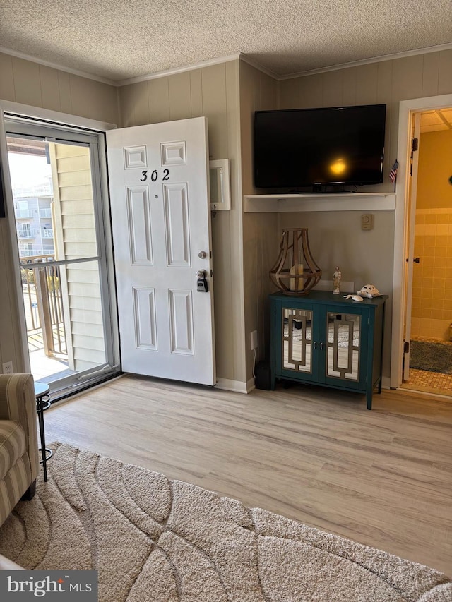 6 122nd St Unit 302, Ocean City, MD 21842 - entrance foyer featuring crown molding and wood finished floors