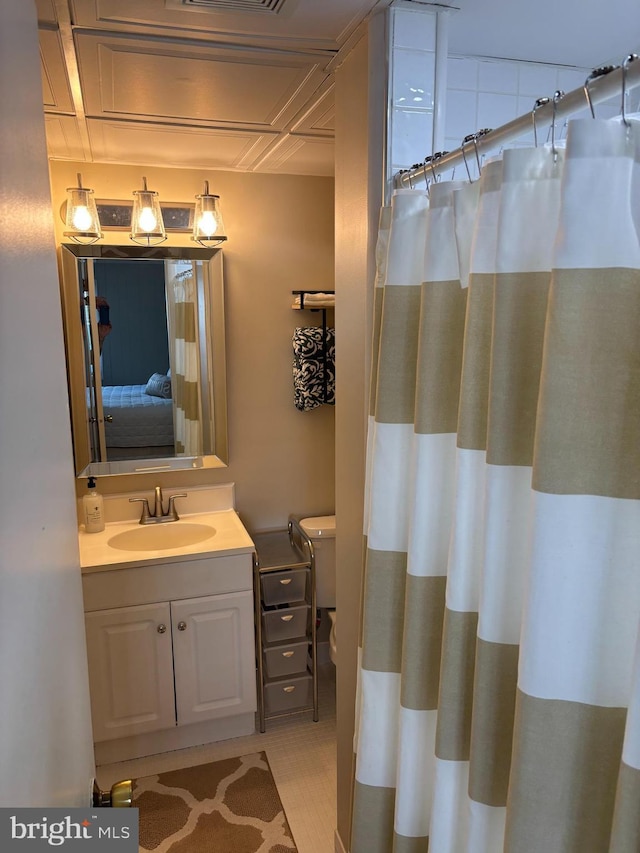 6 122nd St Unit 302, Ocean City, MD 21842 - bathroom with curtained shower, toilet, and vanity