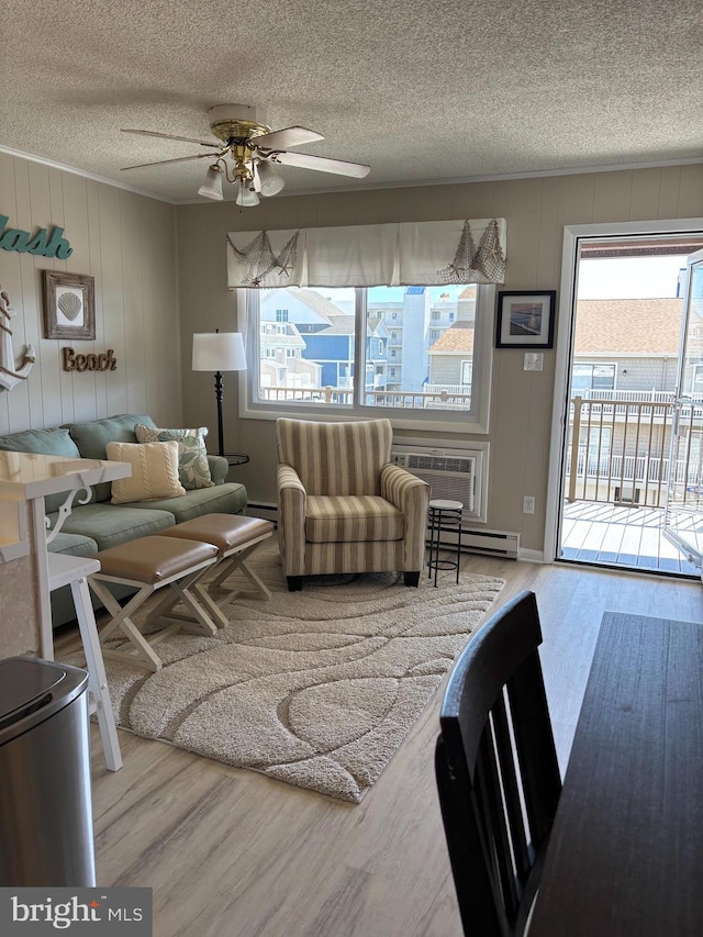 6 122nd St Unit 302, Ocean City, MD 21842 - living area with a textured ceiling, ceiling fan, and wood finished floors