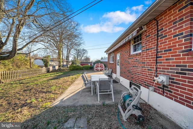 view of patio / terrace featuring fence and outdoor dining space