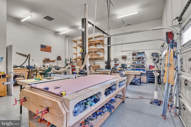 23700 Quiet Oak Ct, California, MD 20619 - garage with visible vents and a workshop area