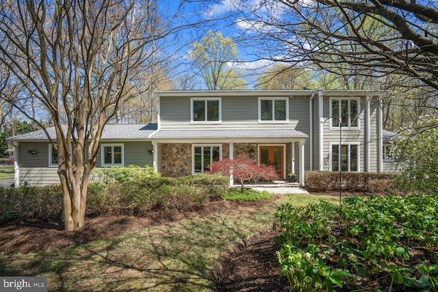 traditional-style house with stone siding