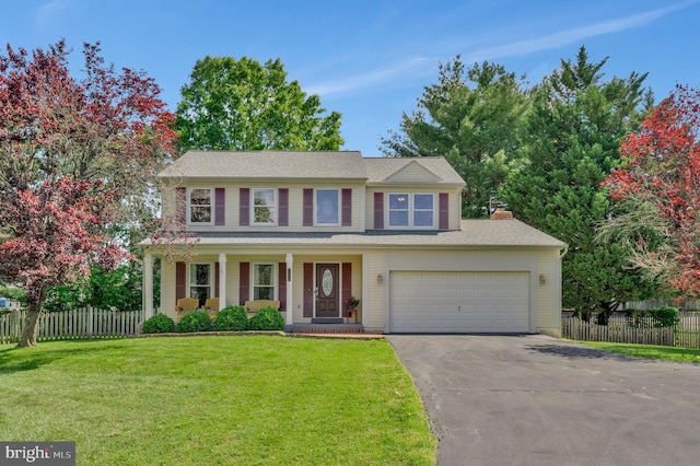 10866 Monticello Ct, Great Falls, VA 22066 - view of front facade with driveway, covered porch, and a garage