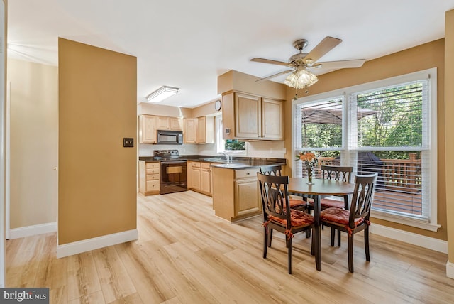 10866 Monticello Ct, Great Falls, VA 22066 - kitchen with black appliances, light brown cabinets, a sink, dark countertops, and a ceiling fan
