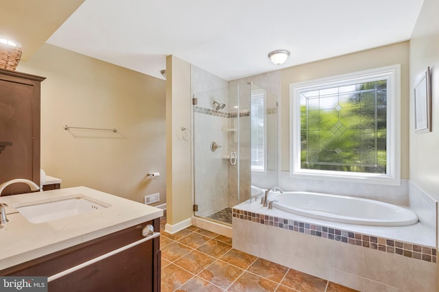 10866 Monticello Ct, Great Falls, VA 22066 - bathroom with tile patterned floors, vanity, a shower stall, and a garden tub