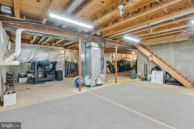 10866 Monticello Ct, Great Falls, VA 22066 - unfinished below grade area featuring water heater, stairs, and heating unit