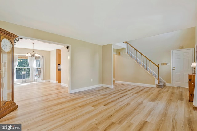 10866 Monticello Ct, Great Falls, VA 22066 - unfurnished living room with stairs, a chandelier, light wood-style flooring, and baseboards