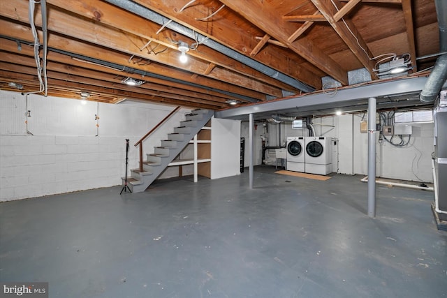 5004 Kennett Pike, Wilmington, DE 19807 - unfinished basement with washer and clothes dryer, stairs, and concrete block wall