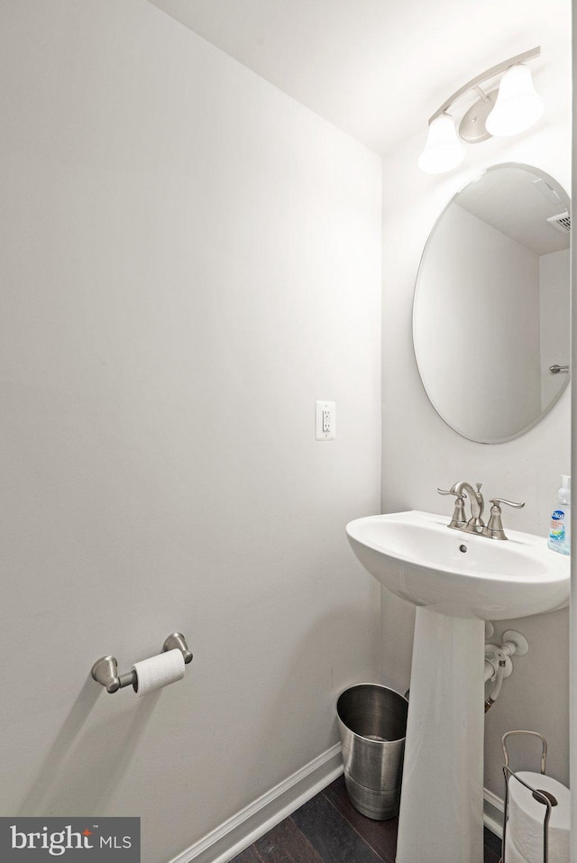 719 Thurlow Ct, Bel Air, MD 21014 - bathroom with wood finished floors, a sink, baseboards, and visible vents
