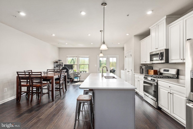 719 Thurlow Ct, Bel Air, MD 21014 - kitchen featuring a sink, light countertops, white cabinetry, and stainless steel appliances