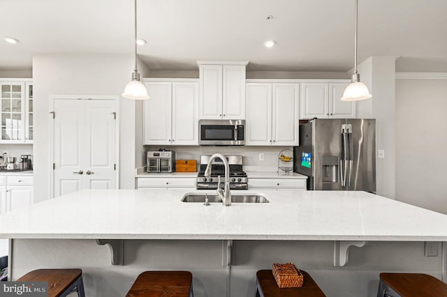 719 Thurlow Ct, Bel Air, MD 21014 - kitchen with a breakfast bar area, a sink, white cabinets, and stainless steel appliances