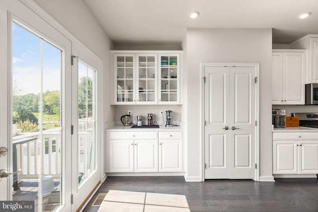 719 Thurlow Ct, Bel Air, MD 21014 - bar with visible vents, recessed lighting, appliances with stainless steel finishes, dark wood-style flooring, and indoor bar