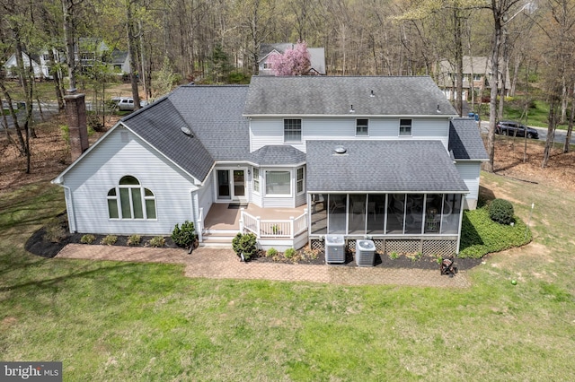 5855 Springmount Ct, Eldersburg, MD 21784 - rear view of property featuring a wooden deck, a sunroom, a yard, and roof with shingles