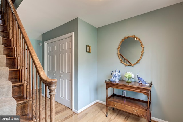 5855 Springmount Ct, Eldersburg, MD 21784 - foyer entrance featuring baseboards, stairs, and light wood finished floors