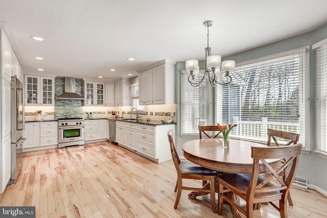 5855 Springmount Ct, Eldersburg, MD 21784 - dining room with baseboards, recessed lighting, a chandelier, and light wood-style floors