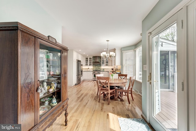 5855 Springmount Ct, Eldersburg, MD 21784 - dining room featuring a wealth of natural light, a chandelier, light wood finished floors, and recessed lighting