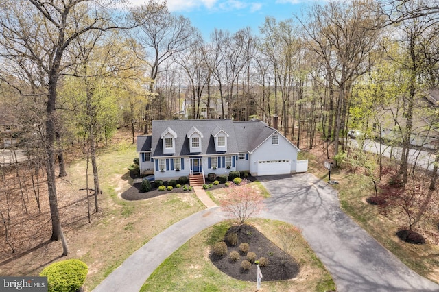 5855 Springmount Ct, Eldersburg, MD 21784 - cape cod-style house with a porch, driveway, roof with shingles, and a garage