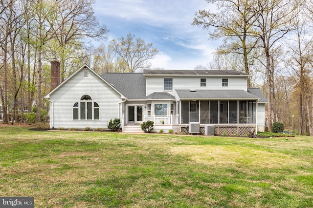 5855 Springmount Ct, Eldersburg, MD 21784 - rear view of house featuring a lawn, a sunroom, and a shingled roof