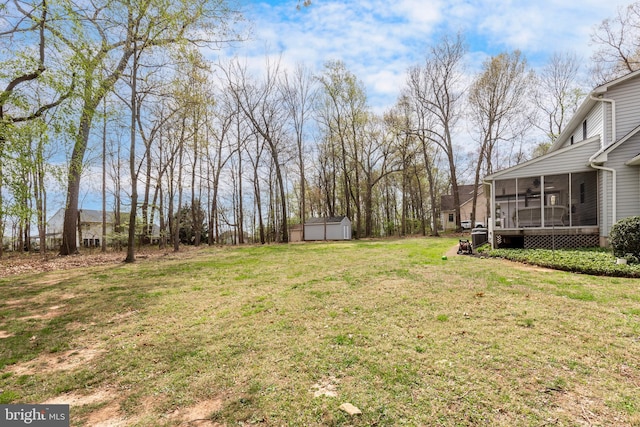 5855 Springmount Ct, Eldersburg, MD 21784 - view of yard with an outdoor structure, a storage unit, and a sunroom