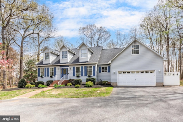 5855 Springmount Ct, Eldersburg, MD 21784 - cape cod house featuring a garage, driveway, and a shingled roof