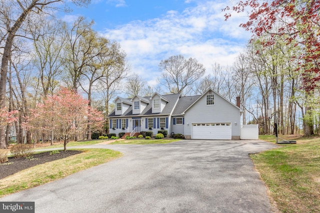 5855 Springmount Ct, Eldersburg, MD 21784 - new england style home with a garage, driveway, roof with shingles, and a front yard