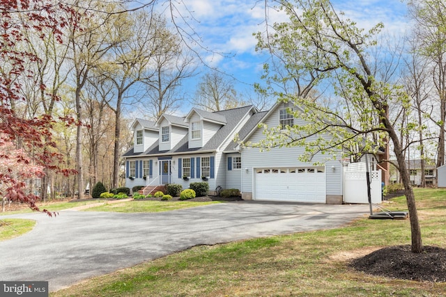 5855 Springmount Ct, Eldersburg, MD 21784 - cape cod house with driveway, a shingled roof, and a front lawn