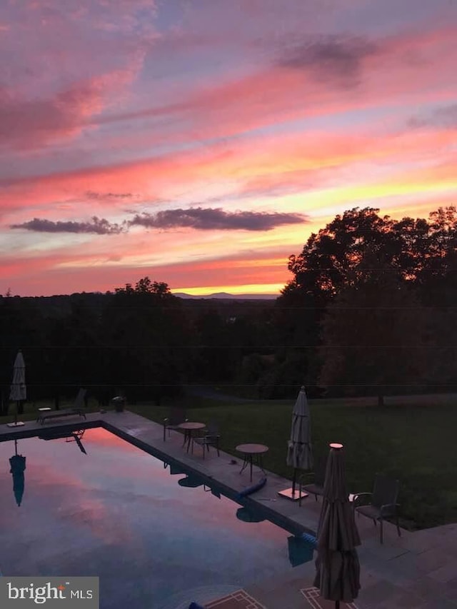 7295 Dudie Rd, Marshall, VA 20115 - pool at dusk featuring an outdoor pool and a patio