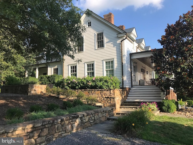 7295 Dudie Rd, Marshall, VA 20115 - view of front of home with a chimney, stairs, and covered porch