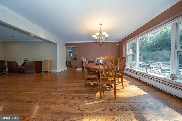 dining area featuring baseboard heating, a chandelier, crown molding, and wood finished floors
