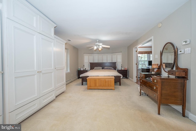 bedroom featuring light colored carpet, visible vents, baseboards, and ceiling fan