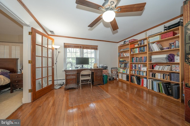 office with a ceiling fan, ornamental molding, hardwood / wood-style floors, and visible vents
