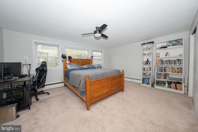 bedroom with a baseboard radiator, light carpet, and multiple windows