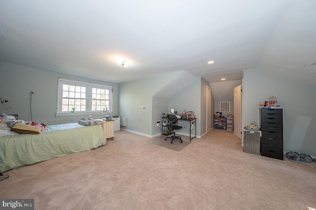bedroom with light colored carpet, vaulted ceiling, baseboards, and visible vents