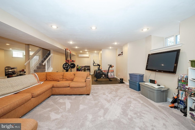 carpeted living area with stairs, a wall mounted air conditioner, baseboards, and recessed lighting
