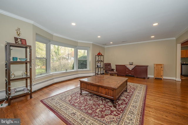 living area featuring crown molding, recessed lighting, and wood finished floors