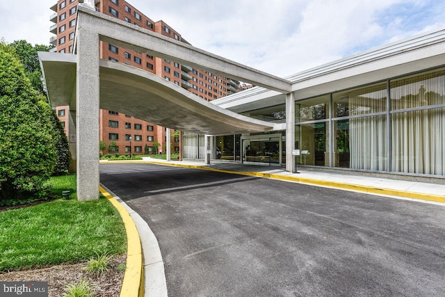 view of property featuring covered parking