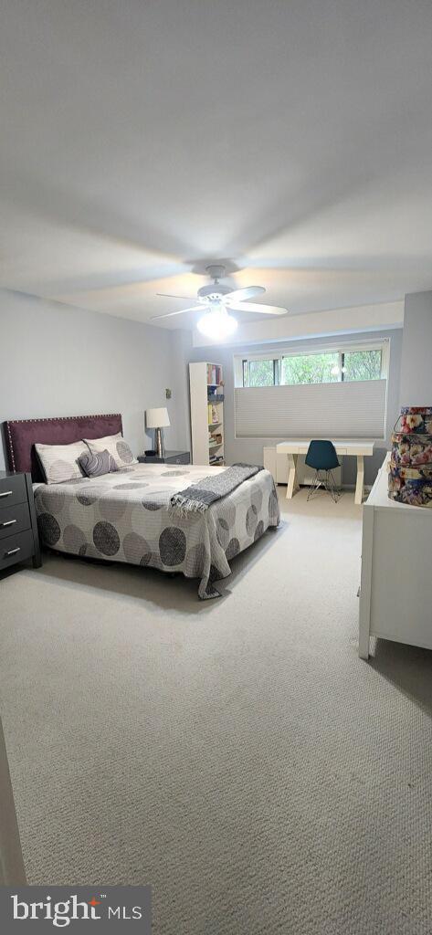 bedroom with carpet flooring and a ceiling fan