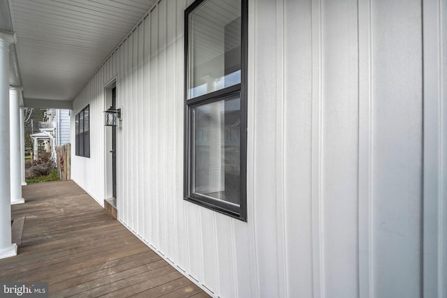 view of side of home with covered porch
