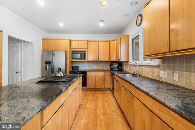 1406 Gentlemens Way, Dresher, PA 19025 - kitchen with black appliances, light wood finished floors, decorative backsplash, dark stone counters, and recessed lighting