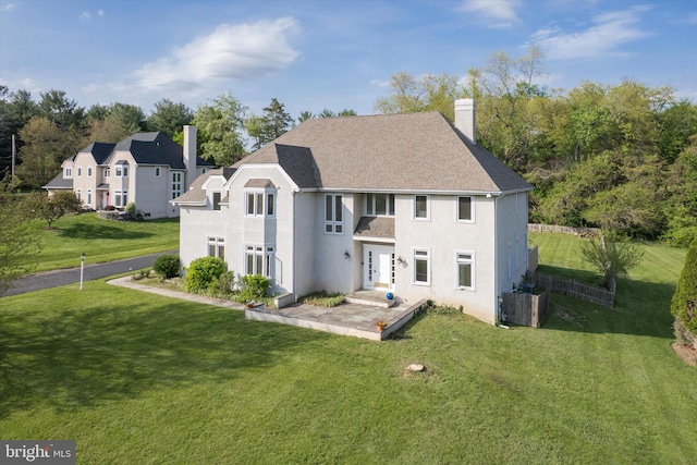 1406 Gentlemens Way, Dresher, PA 19025 - back of house with a chimney, a yard, a patio, and roof with shingles