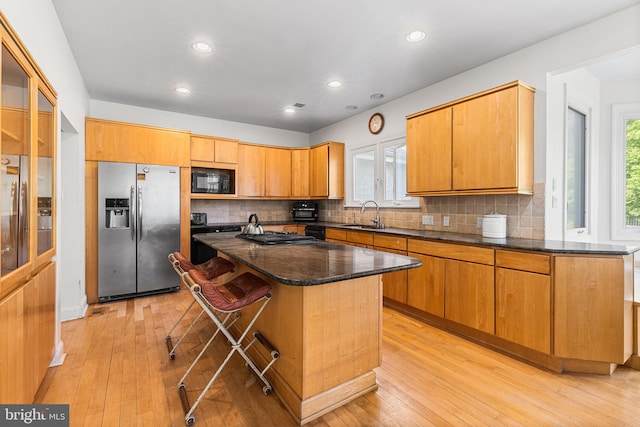 1406 Gentlemens Way, Dresher, PA 19025 - kitchen featuring stainless steel appliances, light wood-style flooring, tasteful backsplash, a center island, and recessed lighting