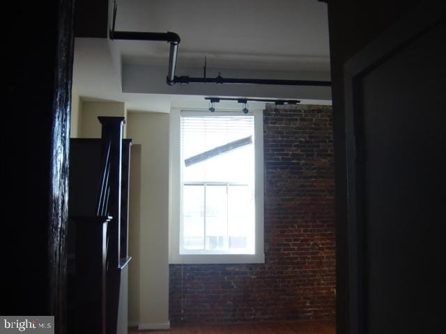 kitchen with brick wall and a healthy amount of sunlight