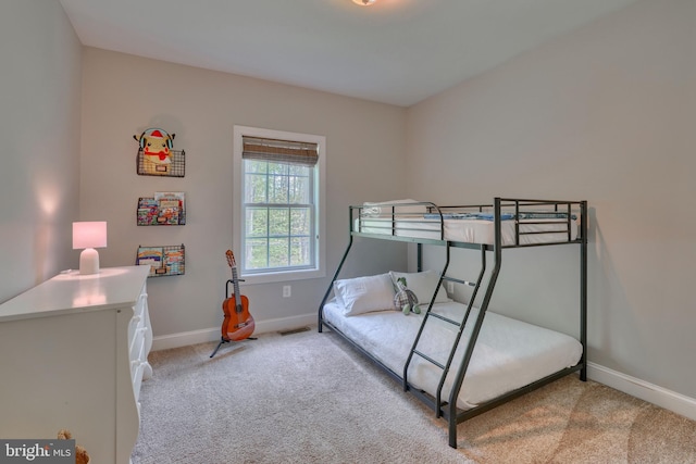 carpeted bedroom with baseboards