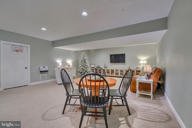 carpeted dining space featuring recessed lighting, visible vents, and baseboards