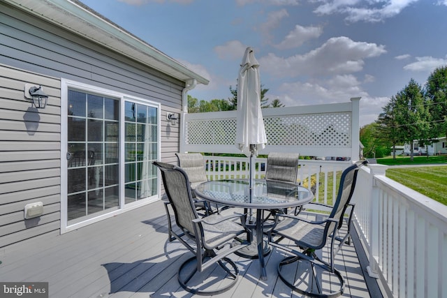 deck featuring outdoor dining area