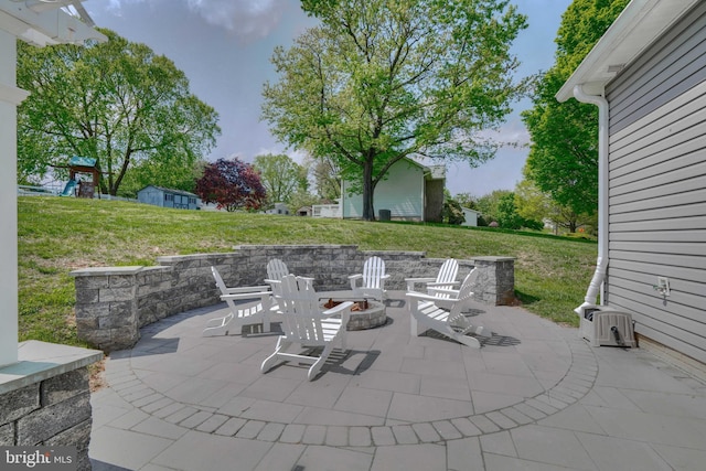 view of patio / terrace with an outdoor fire pit