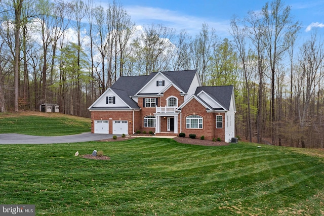 765 Blueberry Ct, Huntingtown, MD 20639 - view of front of house featuring a front yard, an attached garage, cooling unit, brick siding, and driveway