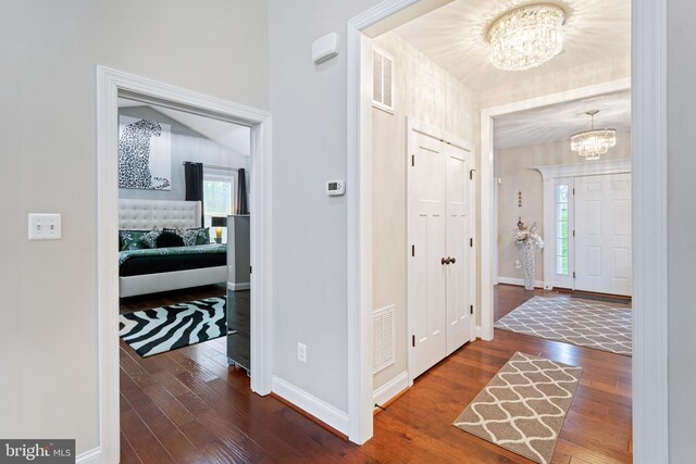 765 Blueberry Ct, Huntingtown, MD 20639 - foyer with visible vents, an inviting chandelier, and hardwood / wood-style flooring