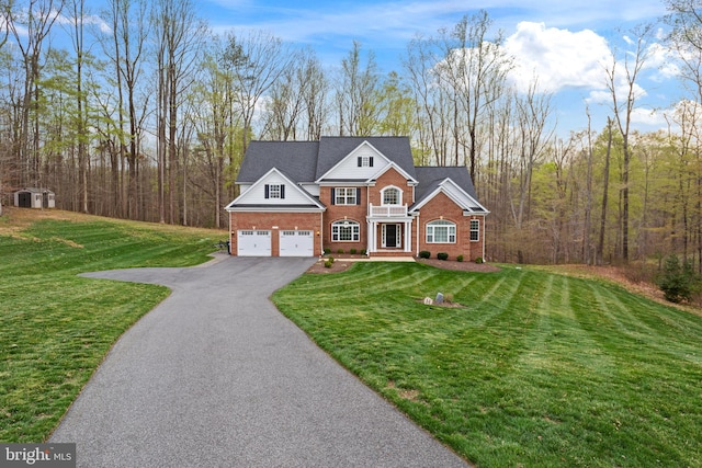 765 Blueberry Ct, Huntingtown, MD 20639 - view of front of home with brick siding, a front lawn, a garage, and aphalt driveway