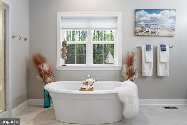 765 Blueberry Ct, Huntingtown, MD 20639 - full bath featuring baseboards, walk in shower, visible vents, a freestanding bath, and marble finish floor